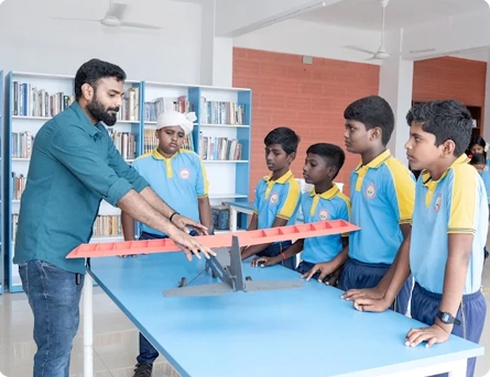 Students building a robotics project in a school lab